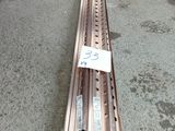 a long metal rail that is laying on the ground