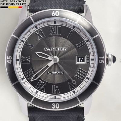 a close up of a watch with roman numerals on the face
