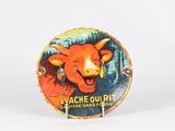 a button that has a picture of a cow on it