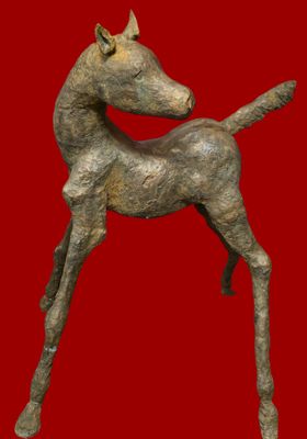 statue of a horse on a red background with a red background
