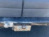 a close up of a car ' s bumper with rust on it