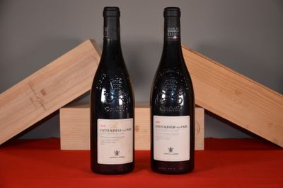 two bottles of wine sitting next to each other on a table