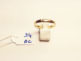 a close up of a gold ring with a price tag attached to it