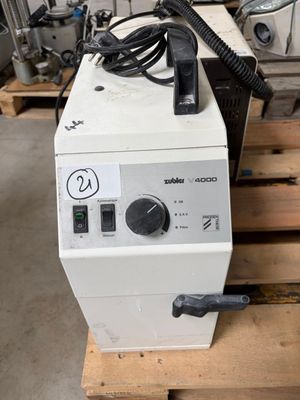 a machine that is sitting on a pallet in a warehouse