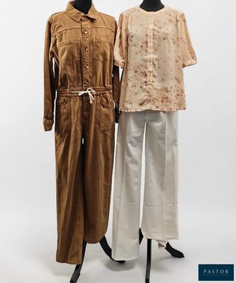 two mannequins wearing brown and white outfits on a mannequin stand