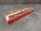 a close up of a train in a red box on a table
