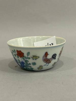 a small bowl with a tag on it