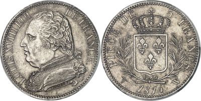 a silver coin with a crown on top of it