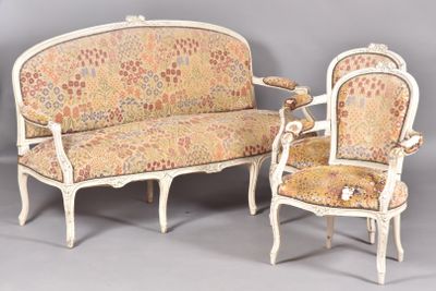 two chairs and a couch are sitting next to each other