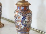 two vases that are sitting on a table