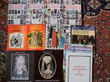 a lot of books on the floor with pictures on them