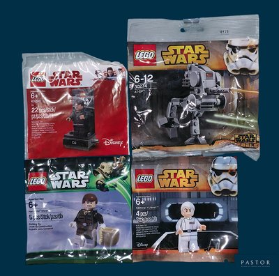 three lego star wars figures in the package
