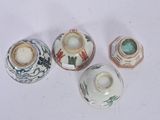 three small vases are sitting next to each other on a white surface