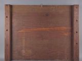 a picture of a wooden box with holes in it
