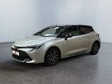 a silver toyota corollion parked in a white room
