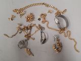 a lot of gold and silver jewelry on the table