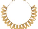 an image of a gold necklace with leaves on it