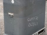 a metal box with a sign on it sitting on the ground