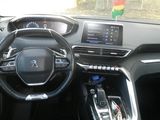 a picture of the interior of a car with a steering wheel and dashboard