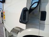 a close up of a truck ' s side mirror with the door open