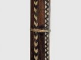a close up of a wooden pole with a pattern on it