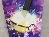 purple and blue pokemon wallet case with a black strap