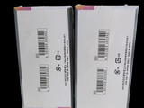 two boxes with a barcode on them on a black background