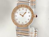 an image of a close up of a wrist watch on a white surface