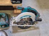 a corded circular saw and a circular saw on the floor