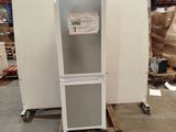 an image of a refrigerator in a warehouse with pallets and boxes