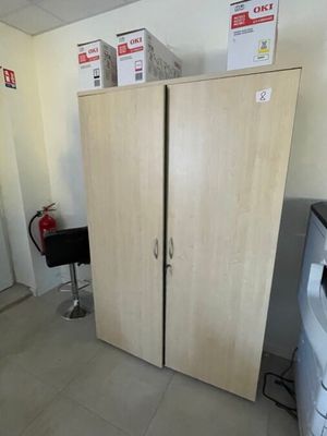 a refrigerator and a washer in a small room