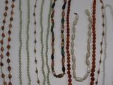 a lot of necklaces that are on a table