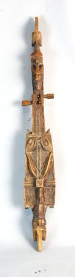 a wooden sculpture of a man on a scooter