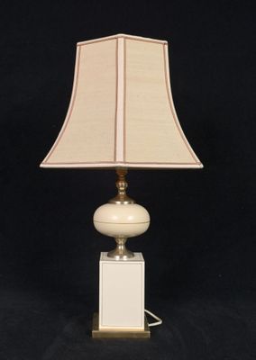 an image of a white lamp with a beige shade on it