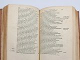 an open book on a table with a white background