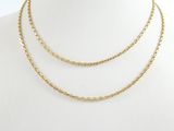 a close up of a gold chain necklace on a mannequin mannequin