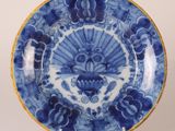 an image of a blue and white plate with flowers on it