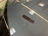 a sticker on the hood of a black car