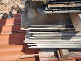 a pile of wood sitting on top of a roof