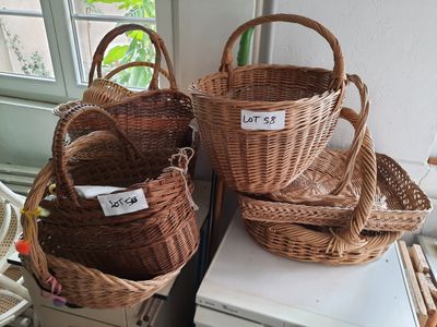 three wicker baskets are stacked on top of each other in front of a window