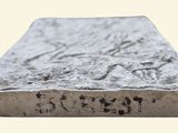 a close up of a baseball base with a number on it