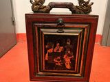 a picture of two birds sitting on top of a picture frame