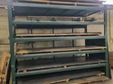 a large stack of wooden planks in a warehouse