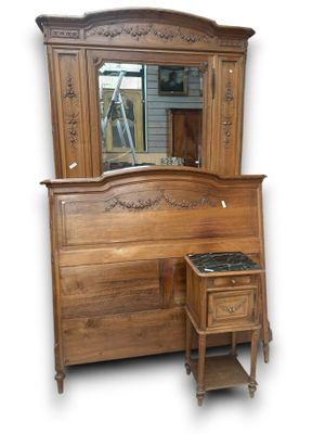 a wooden dresser with a mirror on top of it