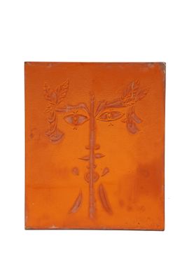 un carreau orange sur lequel est représenté un arbre