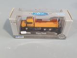 a toy truck that is in a box on a table