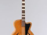 a close up of an acoustic guitar on a white background