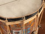 a drum that is sitting on a wooden floor
