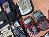 a table with a lot of electronics and tools on it