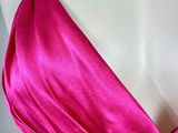 a close up of a pink dress on a mannequin mannequin